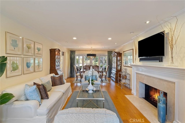 2136 W Gaucho Dr, Rancho Palos Verdes, CA 90275 - living area featuring light wood finished floors, crown molding, a high end fireplace, and recessed lighting