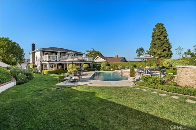 2136 W Gaucho Dr, Rancho Palos Verdes, CA 90275 - rear view of house with a patio, a lawn, an outdoor pool, and a balcony