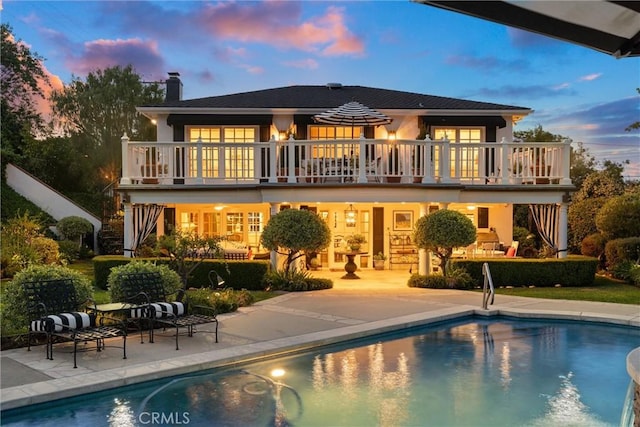 2136 W Gaucho Dr, Rancho Palos Verdes, CA 90275 - rear view of property with a chimney, a patio, a balcony, and stairway