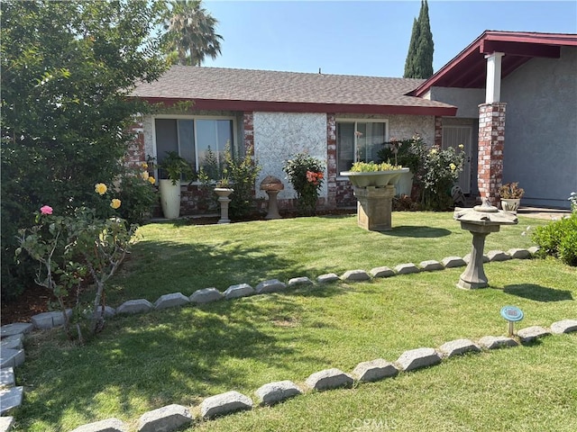 2770 Cole Ave, Highland, CA 92346 - view of front of home with a front lawn, roof with shingles, and stucco siding