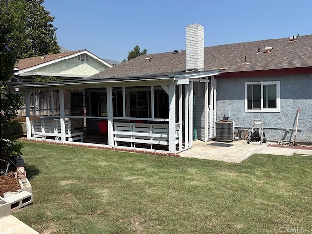 2770 Cole Ave, Highland, CA 92346 - rear view of house featuring a shingled roof, stucco siding, central AC unit, and a lawn
