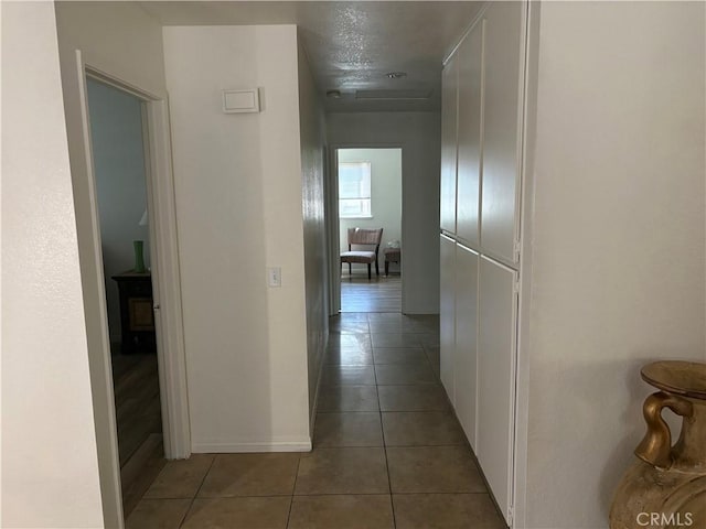 2770 Cole Ave, Highland, CA 92346 - hallway with tile patterned flooring and baseboards