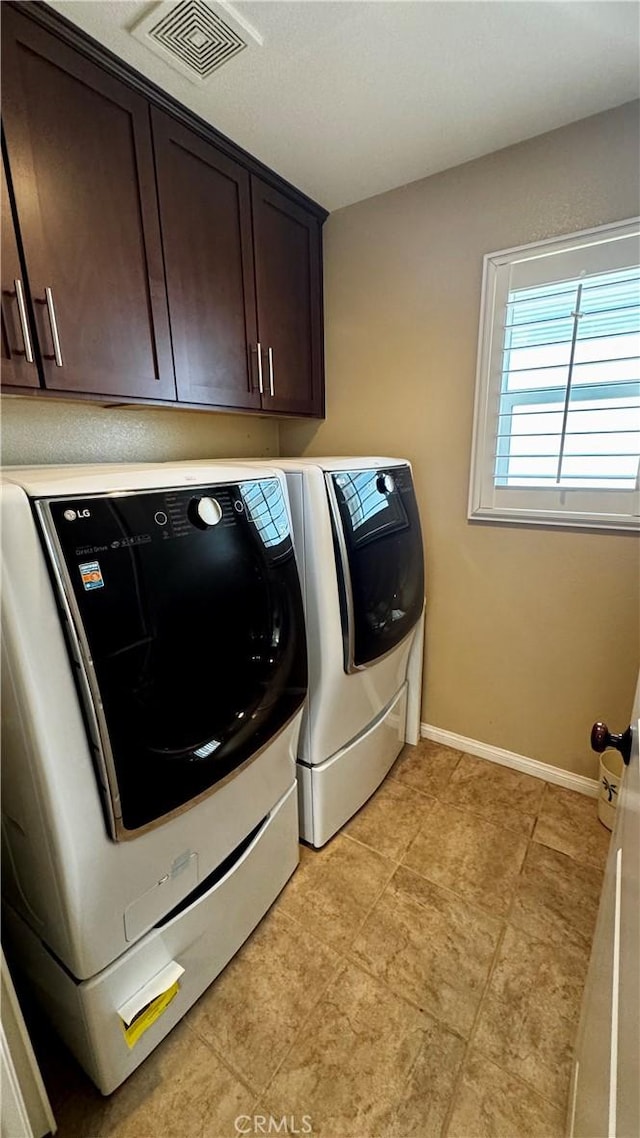 1502 Beacon, Upland, CA 91786 - laundry area featuring washing machine and dryer, cabinet space, and light tile patterned floors