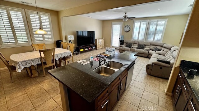 1502 Beacon, Upland, CA 91786 - kitchen featuring light tile patterned floors, open floor plan, an island with sink, hanging light fixtures, and a ceiling fan