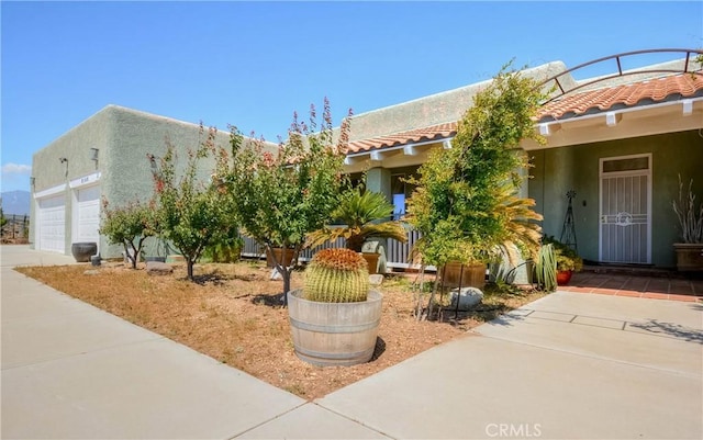 8140 Del Ct, Phelan, CA 92371 - view of front of home featuring a tiled roof, stucco siding, and driveway