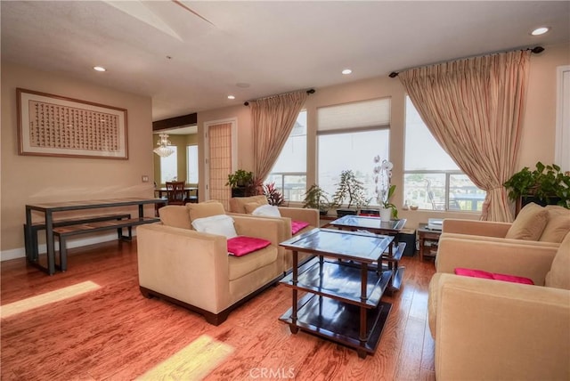 8140 Del Ct, Phelan, CA 92371 - living area with light wood-type flooring, recessed lighting, and a chandelier
