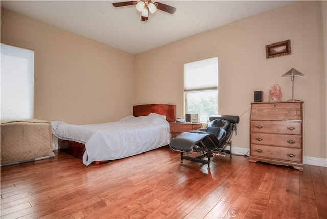 8140 Del Ct, Phelan, CA 92371 - bedroom featuring light wood-style floors, baseboards, and a ceiling fan