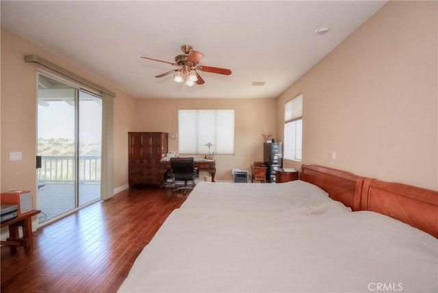 8140 Del Ct, Phelan, CA 92371 - bedroom featuring access to exterior, dark wood-style floors, an office area, water heater, and baseboards