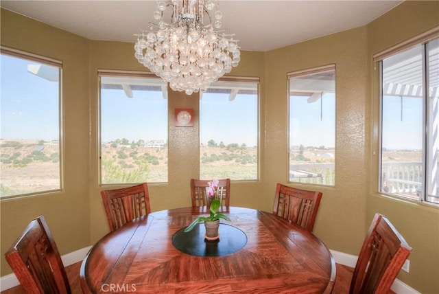 8140 Del Ct, Phelan, CA 92371 - dining space featuring healthy amount of natural light, baseboards, and a chandelier