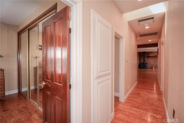 8140 Del Ct, Phelan, CA 92371 - hallway featuring light wood-style floors, recessed lighting, and baseboards