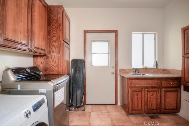 8140 Del Ct, Phelan, CA 92371 - laundry area with washing machine and clothes dryer and cabinet space