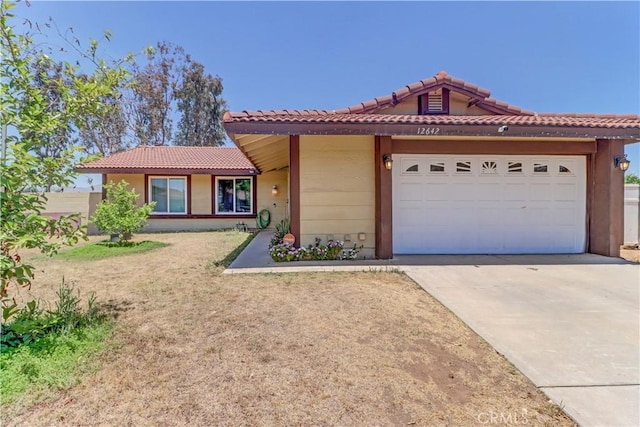 12642 Gorham St, Moreno Valley, CA 92553 - ranch-style house featuring a tile roof, driveway, and an attached garage