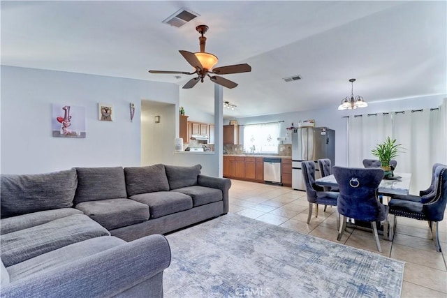 12642 Gorham St, Moreno Valley, CA 92553 - living room featuring light tile patterned floors, ceiling fan, and a chandelier
