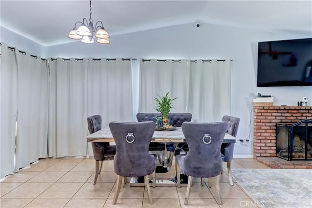 12642 Gorham St, Moreno Valley, CA 92553 - dining room with light tile patterned floors, lofted ceiling, a chandelier, and a fireplace