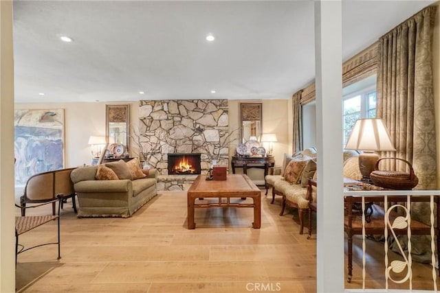 27990 Beechgate Dr, Rancho Palos Verdes, CA 90275 - living room with recessed lighting, light wood finished floors, and a stone fireplace