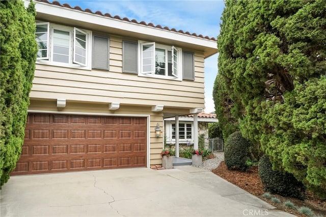 27990 Beechgate Dr, Rancho Palos Verdes, CA 90275 - view of front facade with an attached garage, driveway, and a tile roof