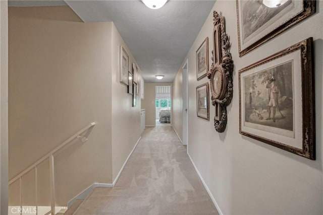 27990 Beechgate Dr, Rancho Palos Verdes, CA 90275 - hall featuring light colored carpet, baseboards, and an upstairs landing