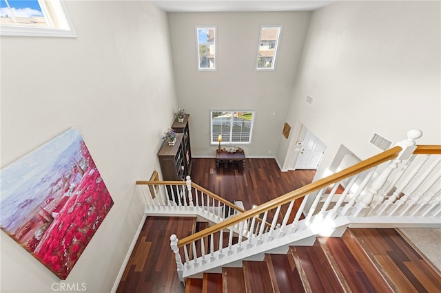 16848 Morning Glory Ct, Chino Hills, CA 91709 - staircase with wood finished floors, a high ceiling, and baseboards