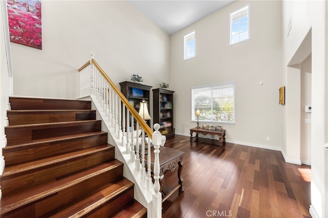 16848 Morning Glory Ct, Chino Hills, CA 91709 - stairway featuring wood finished floors, a high ceiling, and baseboards