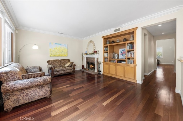 16848 Morning Glory Ct, Chino Hills, CA 91709 - living room featuring dark wood-style flooring, a brick fireplace, ornamental molding, and baseboards
