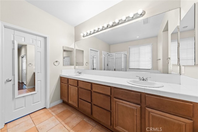 16848 Morning Glory Ct, Chino Hills, CA 91709 - full bathroom featuring a stall shower, double vanity, and tile patterned flooring
