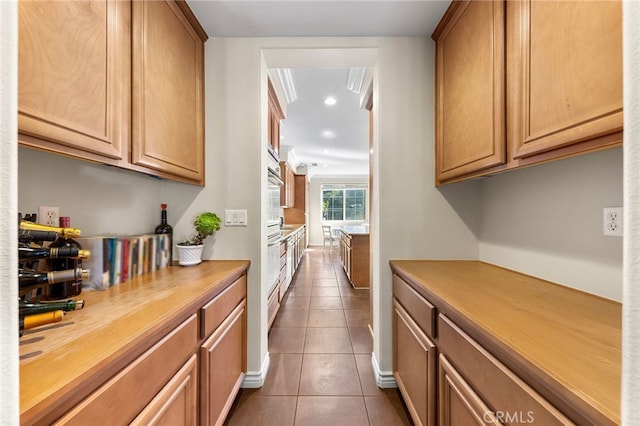 16848 Morning Glory Ct, Chino Hills, CA 91709 - kitchen featuring dark tile patterned floors, recessed lighting, and wooden counters