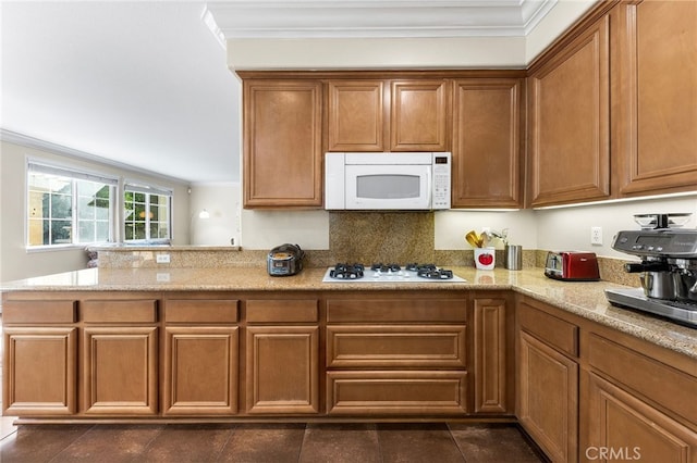 16848 Morning Glory Ct, Chino Hills, CA 91709 - kitchen featuring white appliances, ornamental molding, brown cabinets, light stone countertops, and dark tile patterned floors