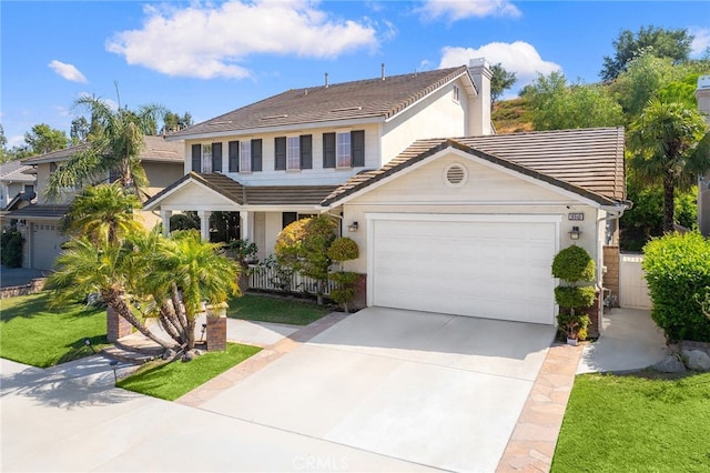 16848 Morning Glory Ct, Chino Hills, CA 91709 - traditional-style home with a garage, driveway, a tiled roof, and stucco siding