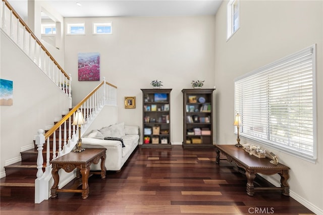 16848 Morning Glory Ct, Chino Hills, CA 91709 - living room featuring wood finished floors, stairway, a high ceiling, and baseboards