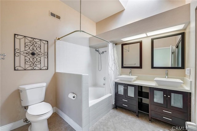 1844 W Falmouth Ave Unit 5, Anaheim, CA 92801 - bathroom with tiled shower / bath combo, tile patterned flooring, toilet, and double vanity
