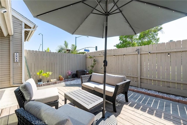 1844 W Falmouth Ave Unit 5, Anaheim, CA 92801 - wooden deck with outdoor lounge area and a fenced backyard