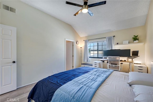 1844 W Falmouth Ave Unit 5, Anaheim, CA 92801 - bedroom with wood finished floors, lofted ceiling, ceiling fan, baseboards, and a textured ceiling