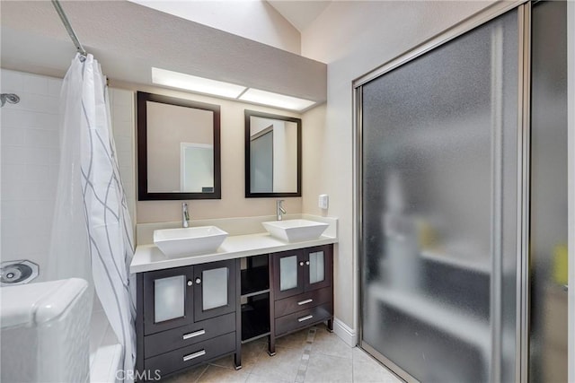 1844 W Falmouth Ave Unit 5, Anaheim, CA 92801 - bathroom featuring double vanity, tile patterned flooring, and a shower with shower curtain