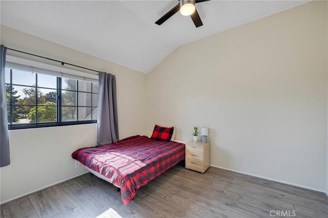 1844 W Falmouth Ave Unit 5, Anaheim, CA 92801 - bedroom with wood finished floors, vaulted ceiling, ceiling fan, and baseboards
