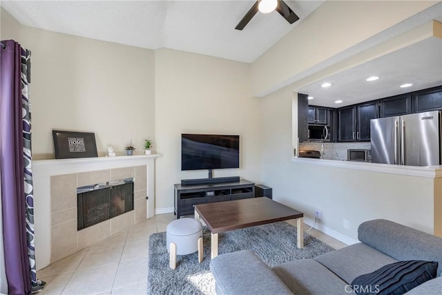 1844 W Falmouth Ave Unit 5, Anaheim, CA 92801 - living room with a ceiling fan, a tile fireplace, recessed lighting, light tile patterned floors, and baseboards