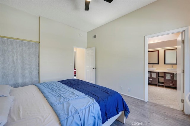 1844 W Falmouth Ave Unit 5, Anaheim, CA 92801 - bedroom featuring wood finished floors, high vaulted ceiling, a sink, ensuite bath, and ceiling fan