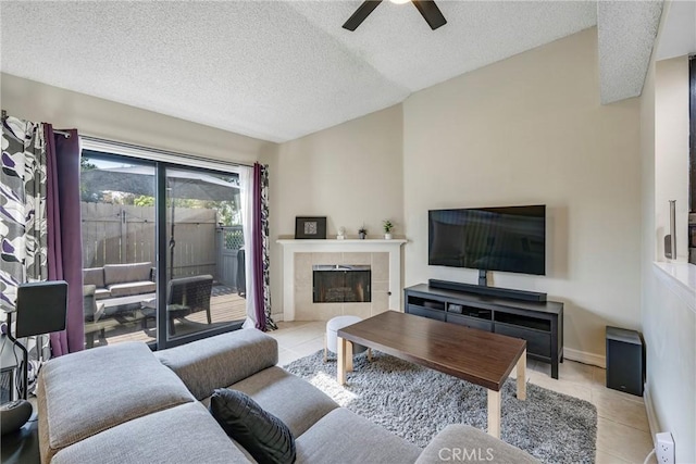 1844 W Falmouth Ave Unit 5, Anaheim, CA 92801 - living room featuring tile patterned flooring, a ceiling fan, a textured ceiling, and a tile fireplace