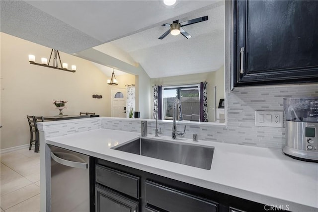 1844 W Falmouth Ave Unit 5, Anaheim, CA 92801 - kitchen featuring a sink, decorative backsplash, vaulted ceiling, dishwasher, and light countertops