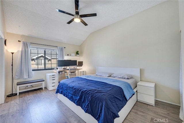 1844 W Falmouth Ave Unit 5, Anaheim, CA 92801 - bedroom featuring wood finished floors, vaulted ceiling, a textured ceiling, and ceiling fan