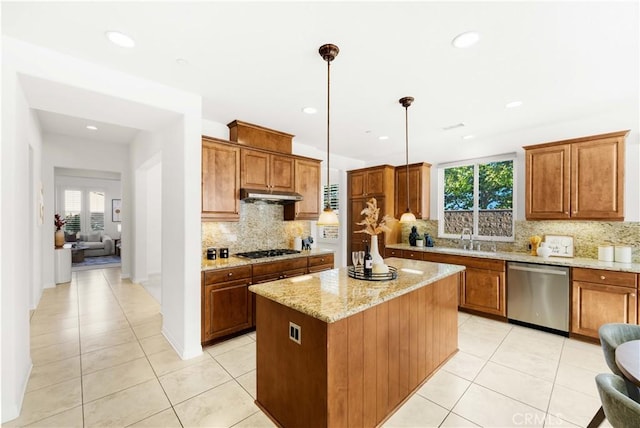 20010 Livorno Ln, Yorba Linda, CA 92886 - kitchen with dishwasher, light tile patterned floors, under cabinet range hood, a sink, and gas cooktop