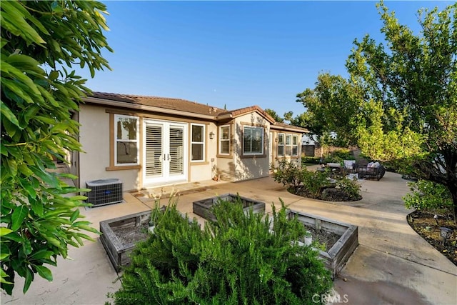 20010 Livorno Ln, Yorba Linda, CA 92886 - back of property with a patio area, cooling unit, a tiled roof, stucco siding, and french doors