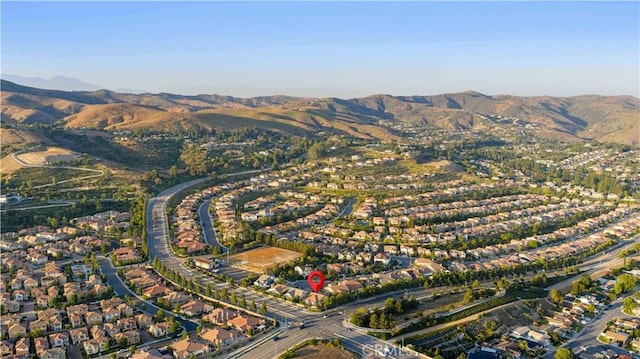 20010 Livorno Ln, Yorba Linda, CA 92886 - aerial overview of property's location with a mountainous background and nearby suburban area