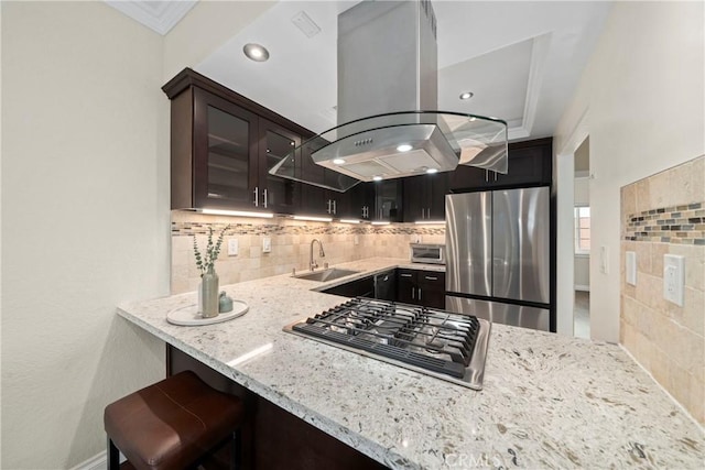1845 Plaza Del Amo Unit C, Torrance, CA 90501 - kitchen featuring stainless steel appliances, island range hood, light stone counters, glass insert cabinets, and decorative backsplash