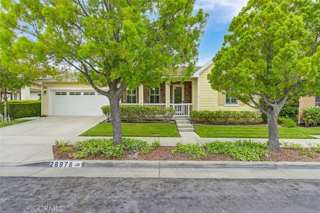 28978 Williston Ct, Temecula, CA 92591 - obstructed view of property featuring a porch, driveway, a front lawn, and a garage