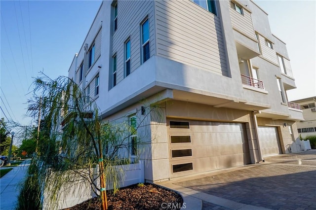 137 Saint Francis St Unit A, San Gabriel, CA 91776 - view of building exterior with a garage and decorative driveway