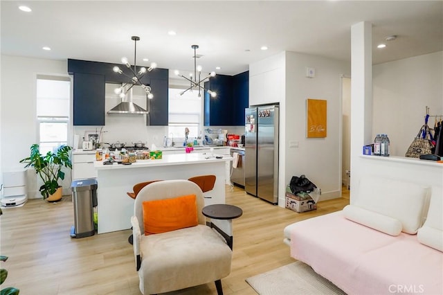 137 Saint Francis St Unit A, San Gabriel, CA 91776 - living room featuring a chandelier, light wood-style flooring, plenty of natural light, and recessed lighting