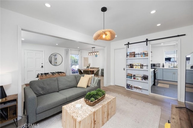 108 Bennett Ave, Long Beach, CA 90803 - living area featuring light wood finished floors, recessed lighting, and a barn door