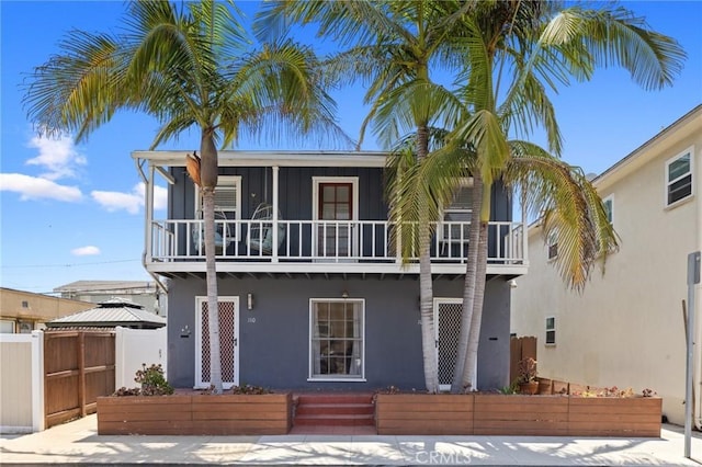 108 Bennett Ave, Long Beach, CA 90803 - view of front facade with stucco siding, a balcony, and board and batten siding