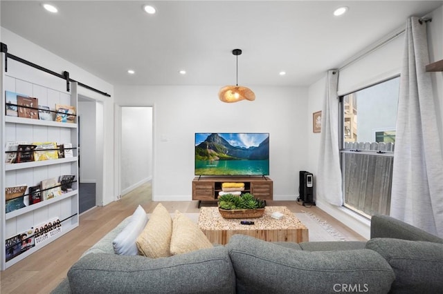 108 Bennett Ave, Long Beach, CA 90803 - living area featuring a barn door, wood finished floors, and recessed lighting