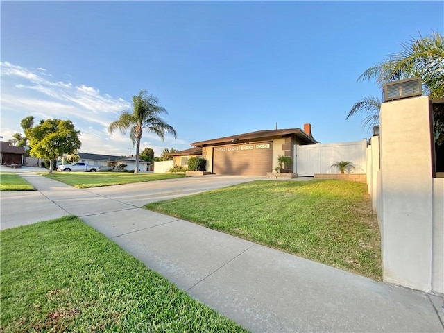 743 N Beechwood Ave, Rialto, CA 92376 - view of front of property featuring concrete driveway and an attached garage